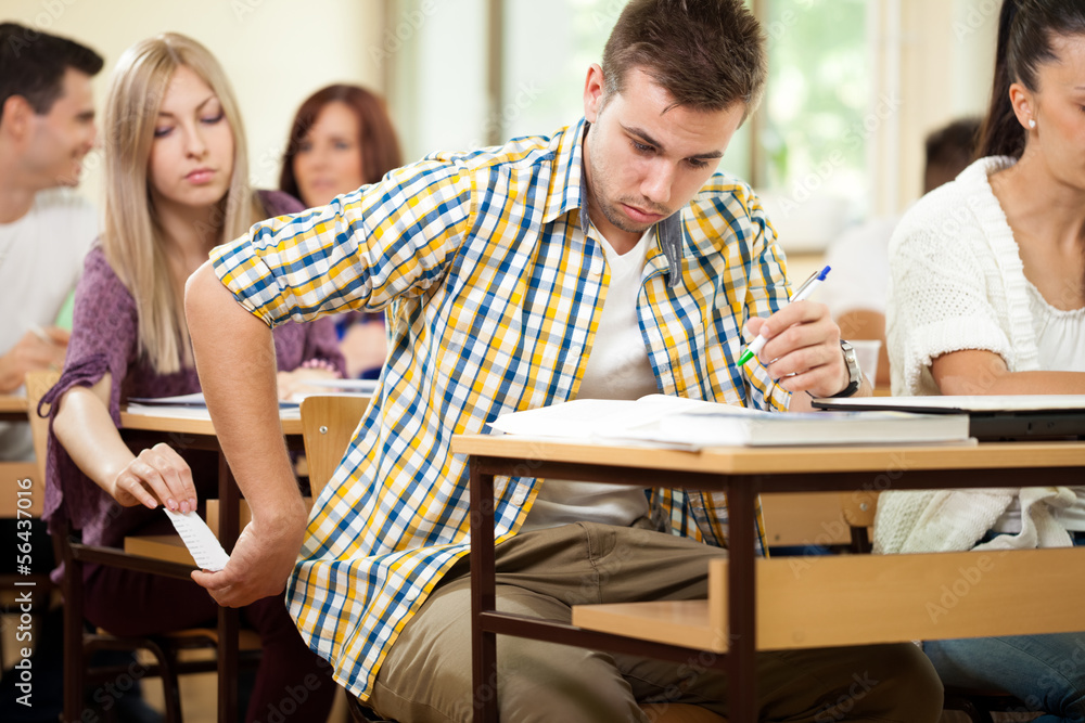 Fototapeta premium Students cheating with cheat sheet