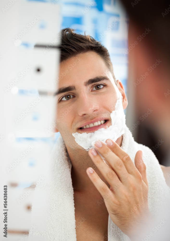 man putting shaving cream