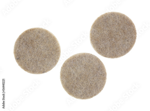 Three felt surface protectors on a white background