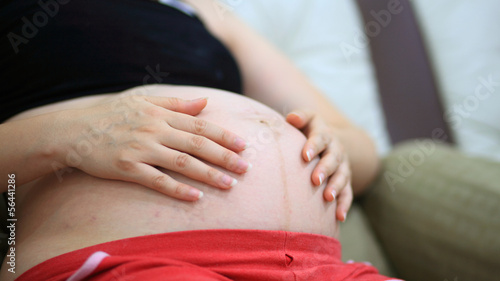 Wallpaper Mural Pregnant woman hold her belly Torontodigital.ca