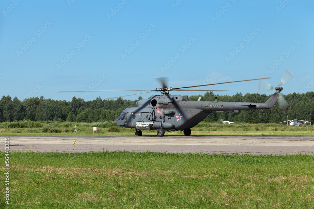 The military helicopter at the airfield preparing for take-off The military helicopter at the airfield preparing for take-off