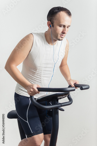 Man exercising on stationary bike