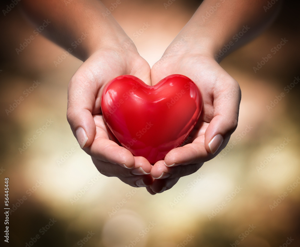 heart in heart hands- warm background heart in heart hands- warm background