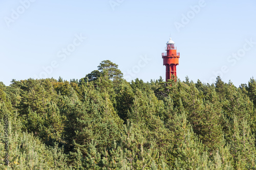 Red lighthouse in forest