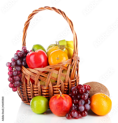 Different fruits in wicker basket isolated on white