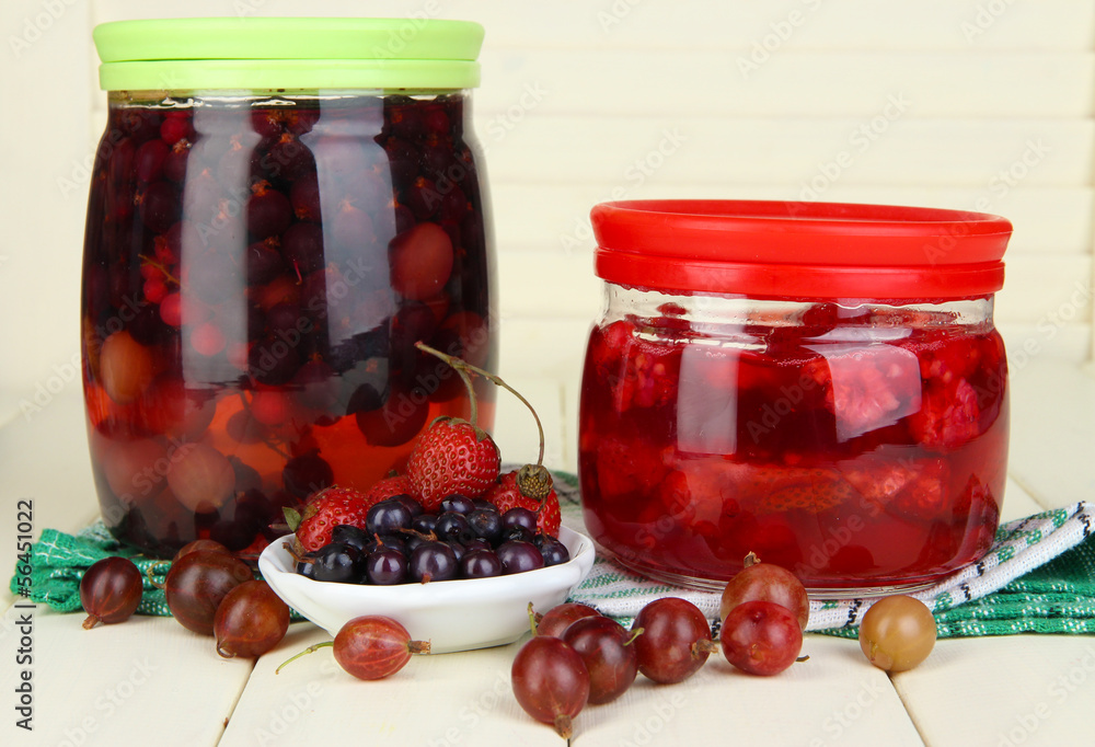 Home made berry jam on wooden table Home made berry jam on wooden table