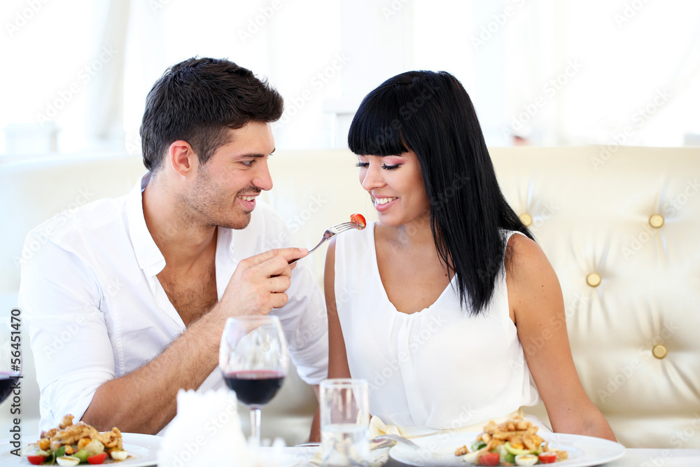 Beautiful couple having romantic dinner at restaurant Beautiful couple having romantic dinner at restaurant