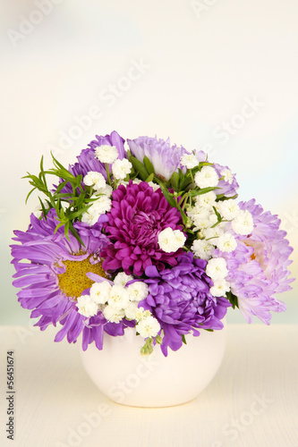 Fototapeta Naklejka Na Ścianę i Meble -  Beautiful bouquet of bright flowers in color vase,