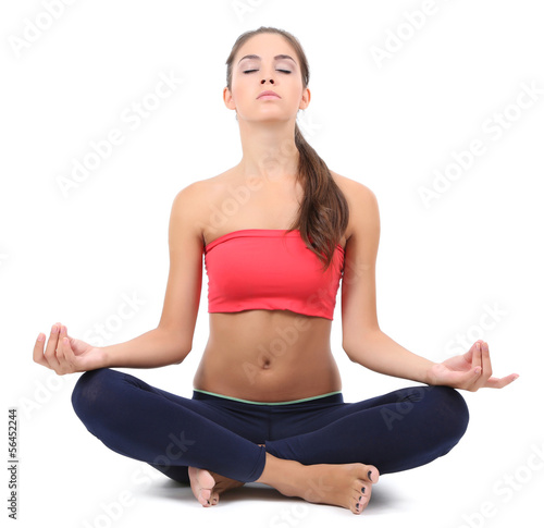Young beautiful fitness girl doing yoga exercise isolated