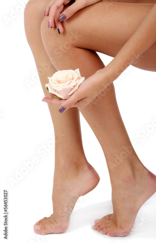 Fototapeta Naklejka Na Ścianę i Meble -  Beautiful female legs close-up isolated on white