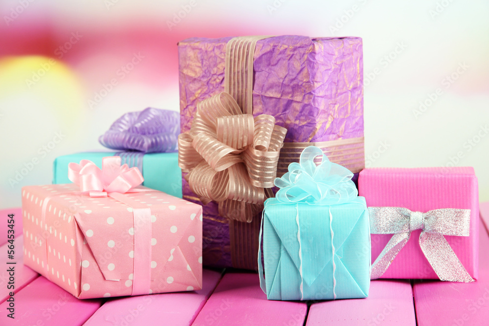 Beautiful bright gifts, on bright wooden table
