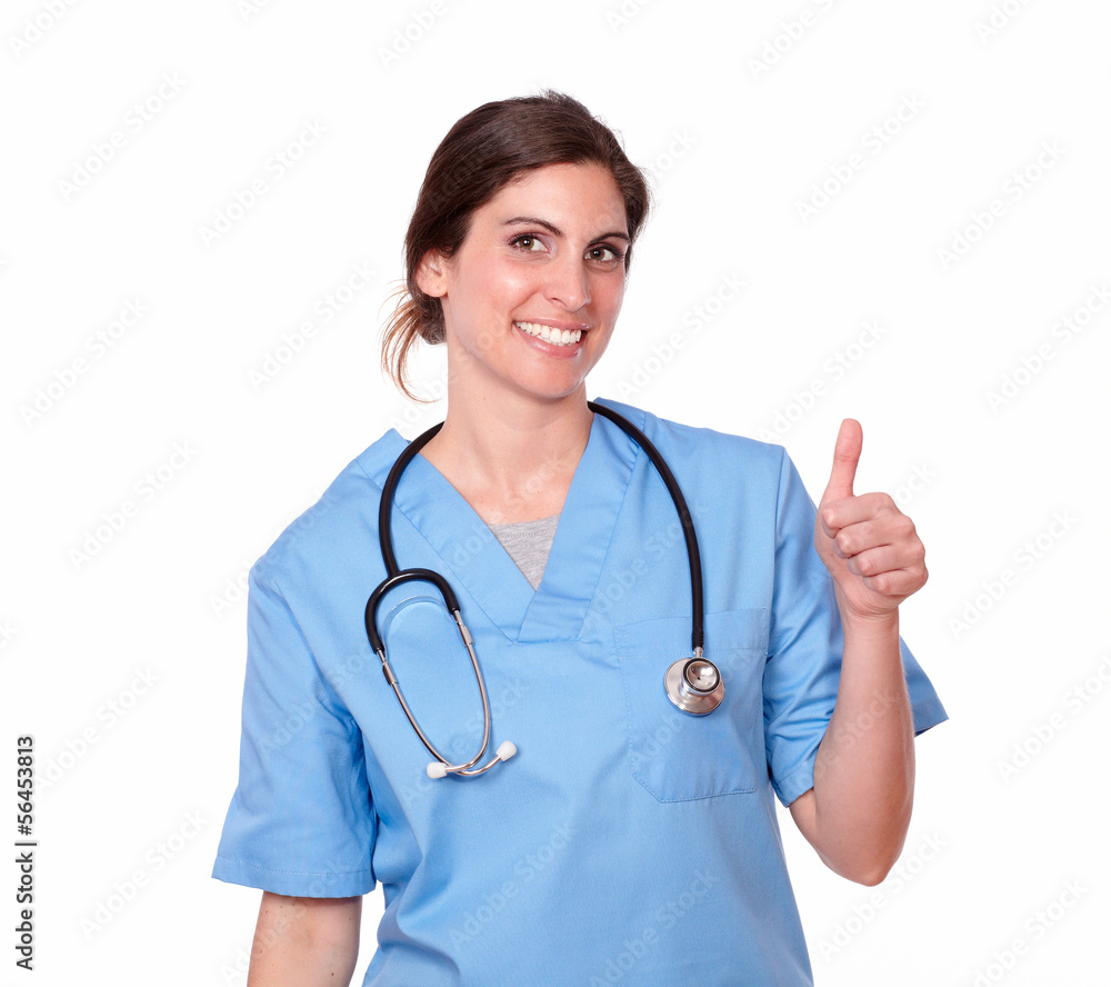 Latin nurse smiling with an ok thumb sign Latin nurse smiling with an ok thumb sign