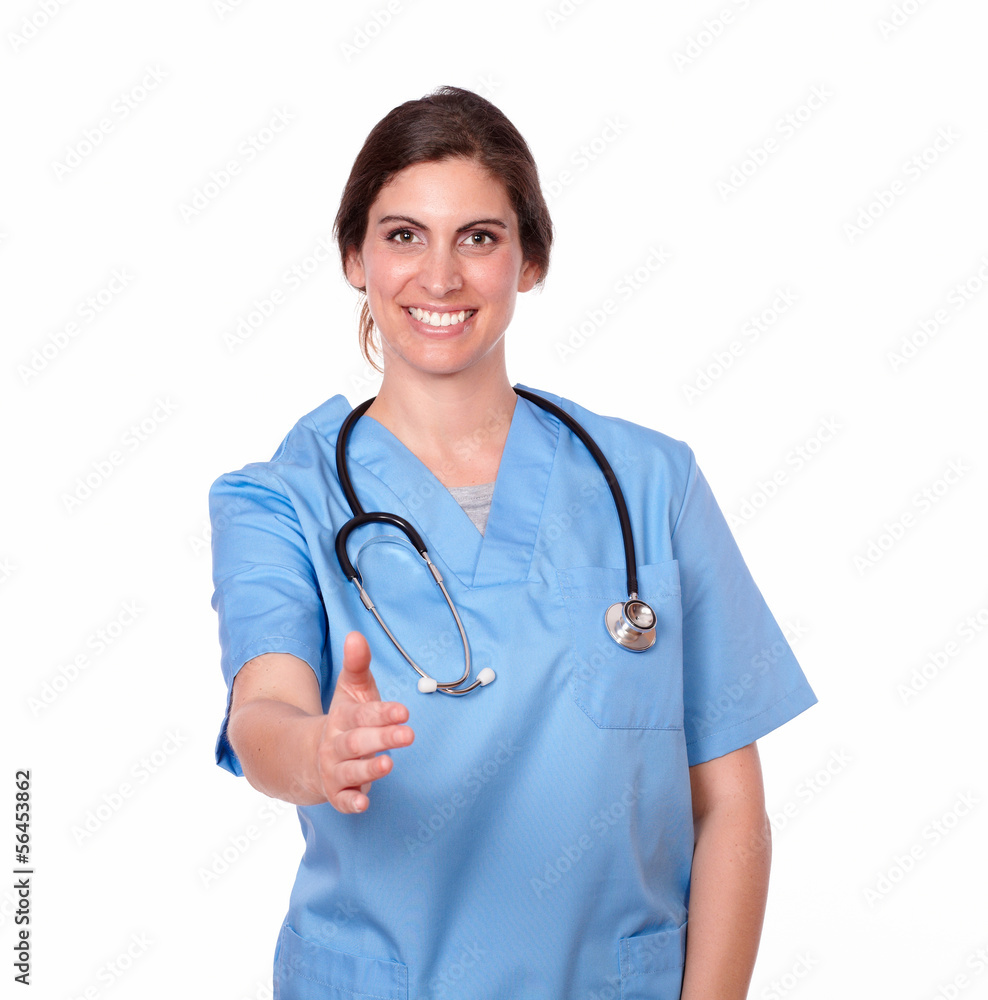 Young lady nurse smiling with an ok hand gesture Young lady nurse smiling with an ok hand gesture