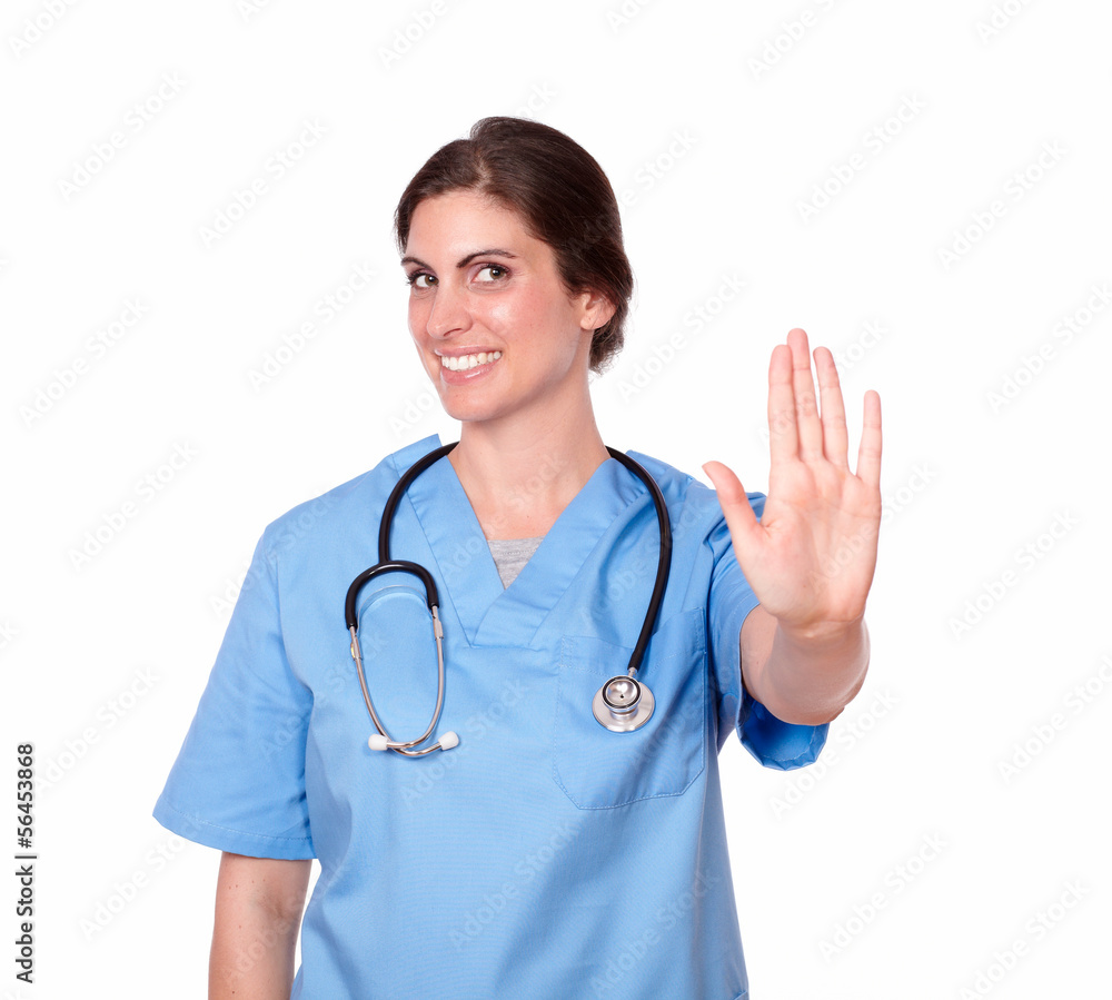 Young nurse in blue having a high hand gesture Young nurse in blue having a high hand gesture