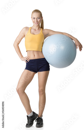 nice woman posing with fitness ball