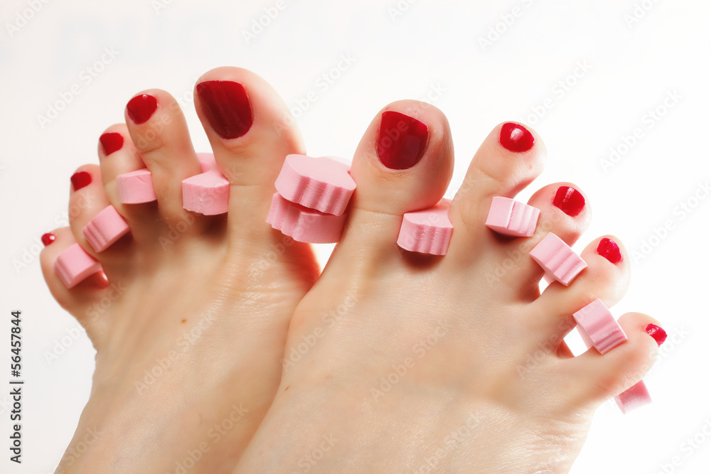 foot pedicure applying red toenails on white Stock Photo Adobe Stock