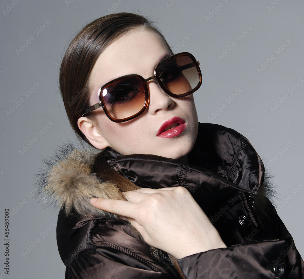 Closeup portrait of gorgeous young lady in sunglasses Closeup portrait of gorgeous young lady in sunglasses