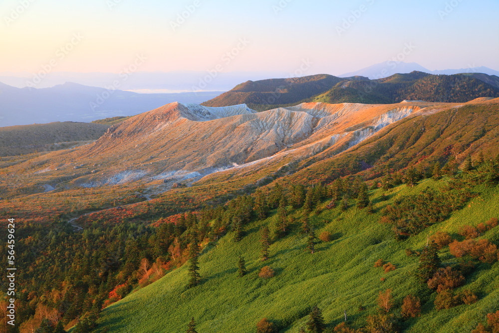 Fototapeta premium Mt. Kusatsu-Shirane glows in the morning sun, Japan