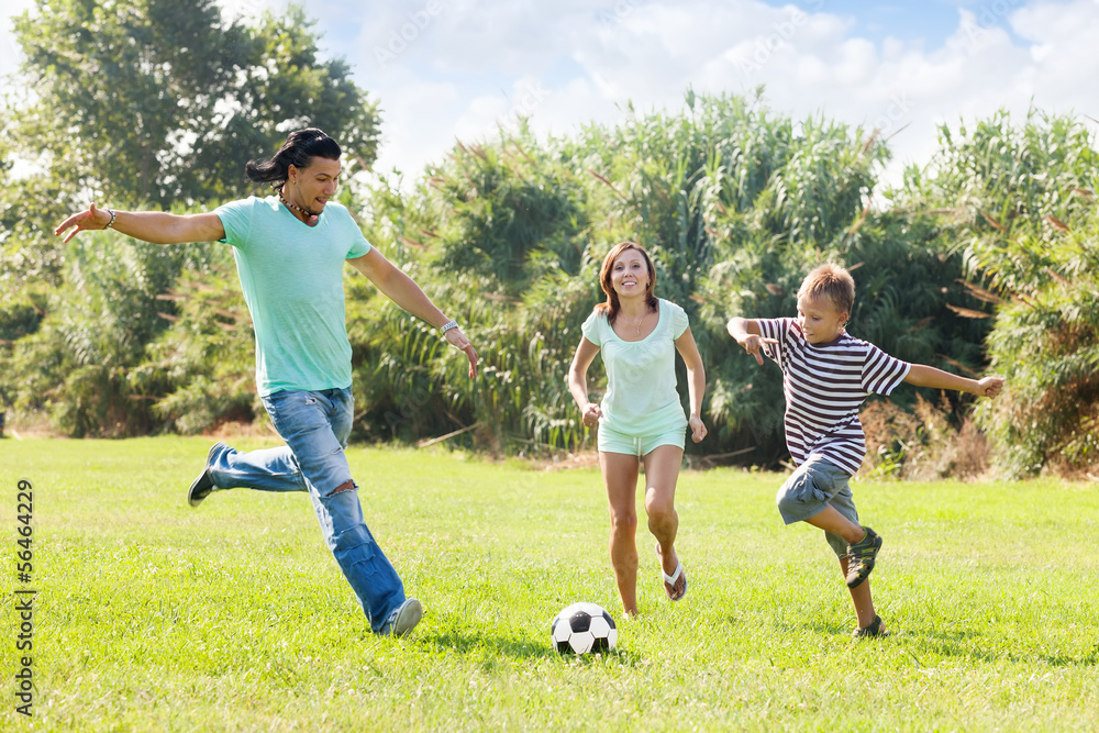 Obraz premium Family with teenager playing in soccer