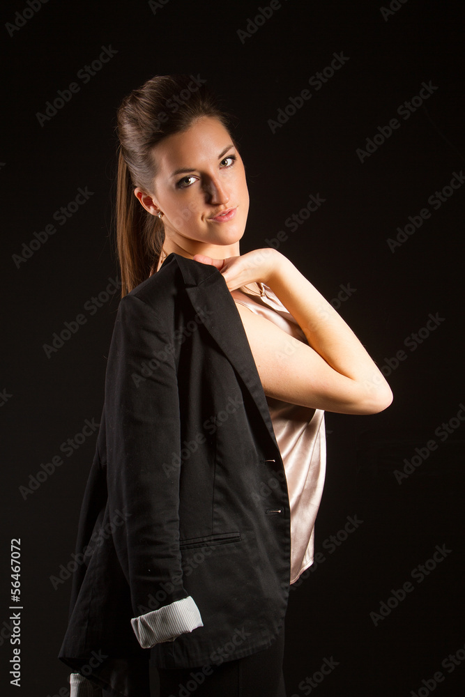 Portrait of beautiful woman posing in studio with jacket Portrait of beautiful woman posing in studio with jacket