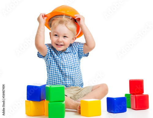 kid playing with building b...