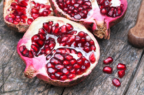 Juicy pomegranates on wood