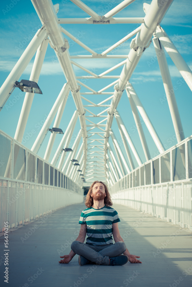 stylish hipster model with long red hair and beard yoga