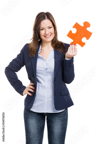 Business woman holding a puzzle piece