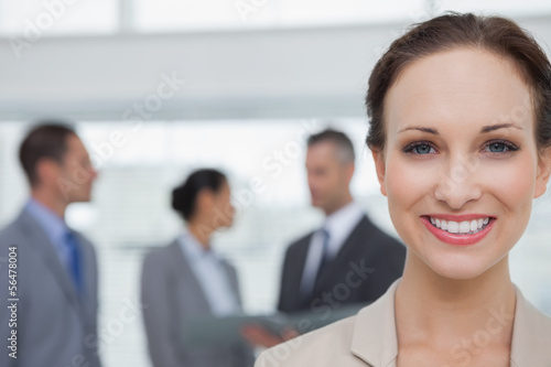 Cheerful businesswoman smiling at camera