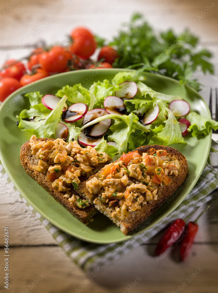 slice bread with chicken and mixed salad, selective focus