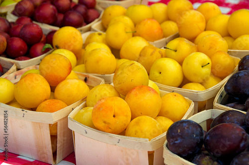 variety of ripe plums at the market