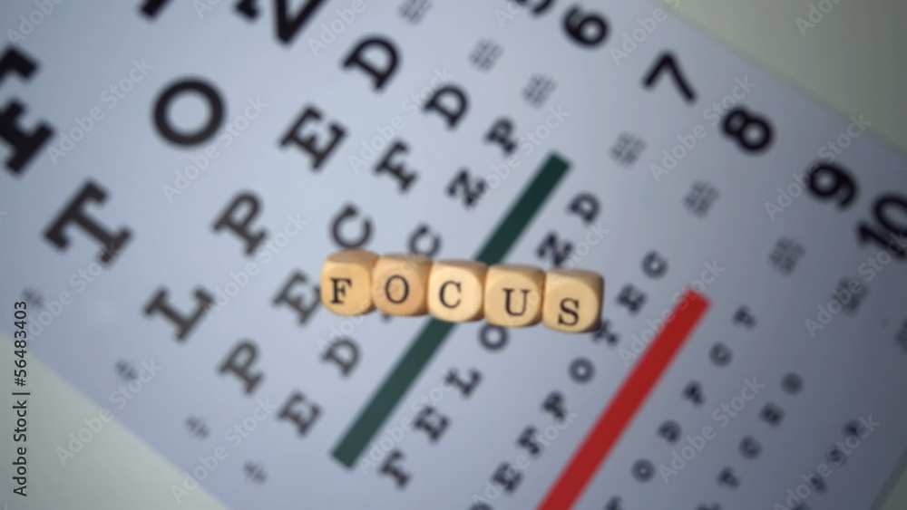 Dice spelling out focus falling on eye test Dice spelling out focus falling on eye test