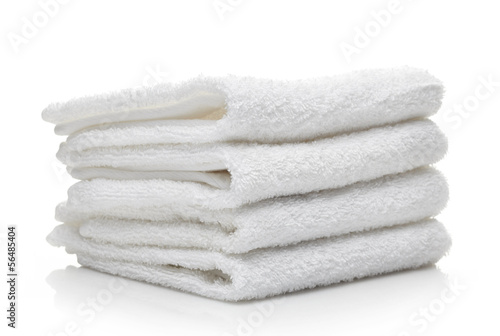 Stack of white hotel towels on a white background