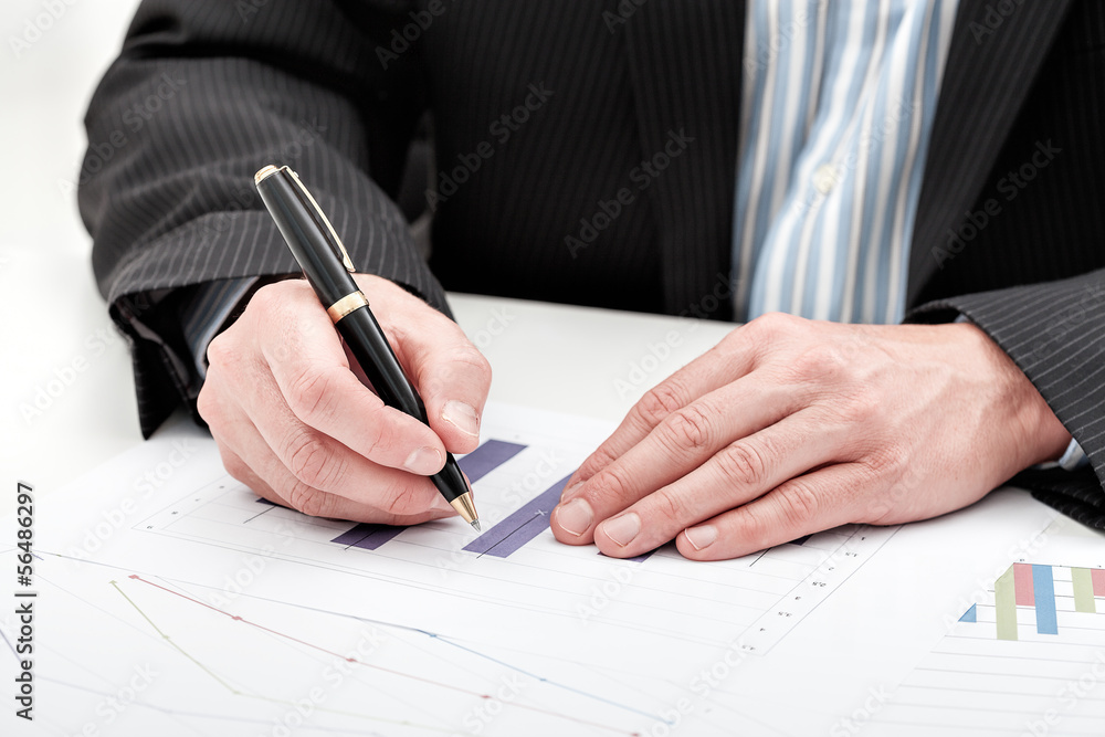 Businessman with bar chart Businessman with bar chart