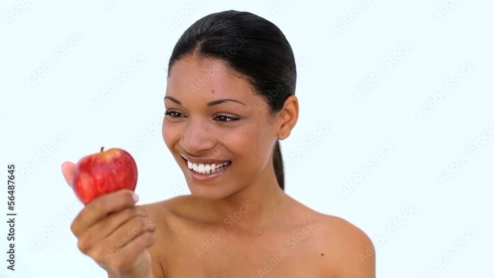 Happy woman showing red apple at camera Happy woman showing red apple at camera