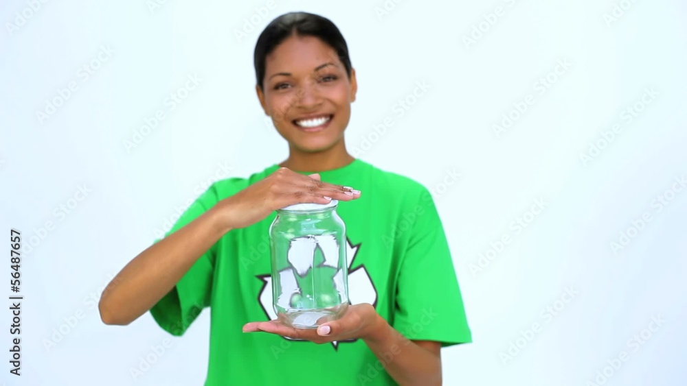 Ecological woman holding jar and does thumbs up at camera Ecological woman holding jar and does thumbs up at camera