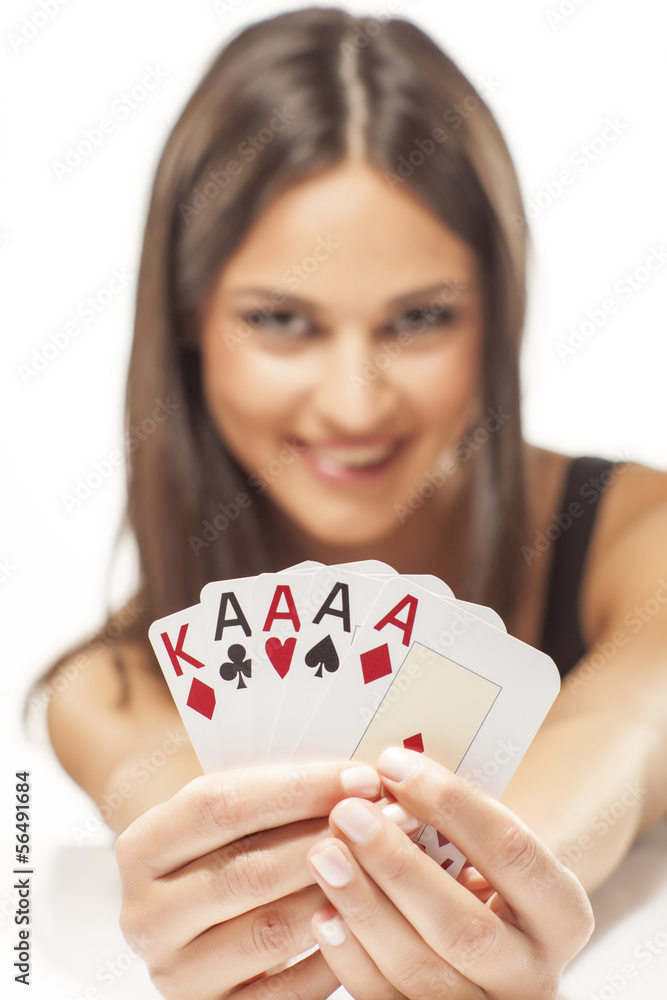 Happy girl holding the winning combination of poker cards Happy girl holding the winning combination of poker cards