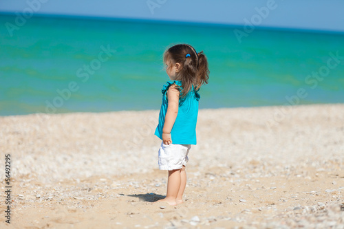 little girl have a good time at the beach © A.Kazak