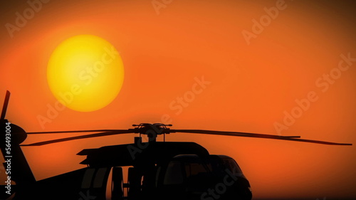 Helicopter taking off on a beautiful sunset or sunrise