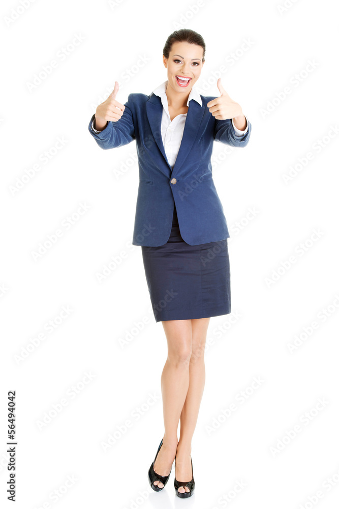 Smiling business woman with thumbs up gesture Smiling business woman with thumbs up gesture
