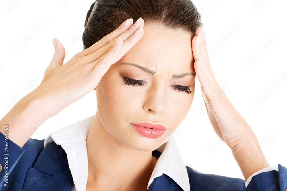 Fototapeta premium Businesswoman with a headache holding head