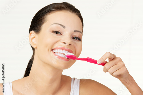 Woman holding tooth brush  isolated