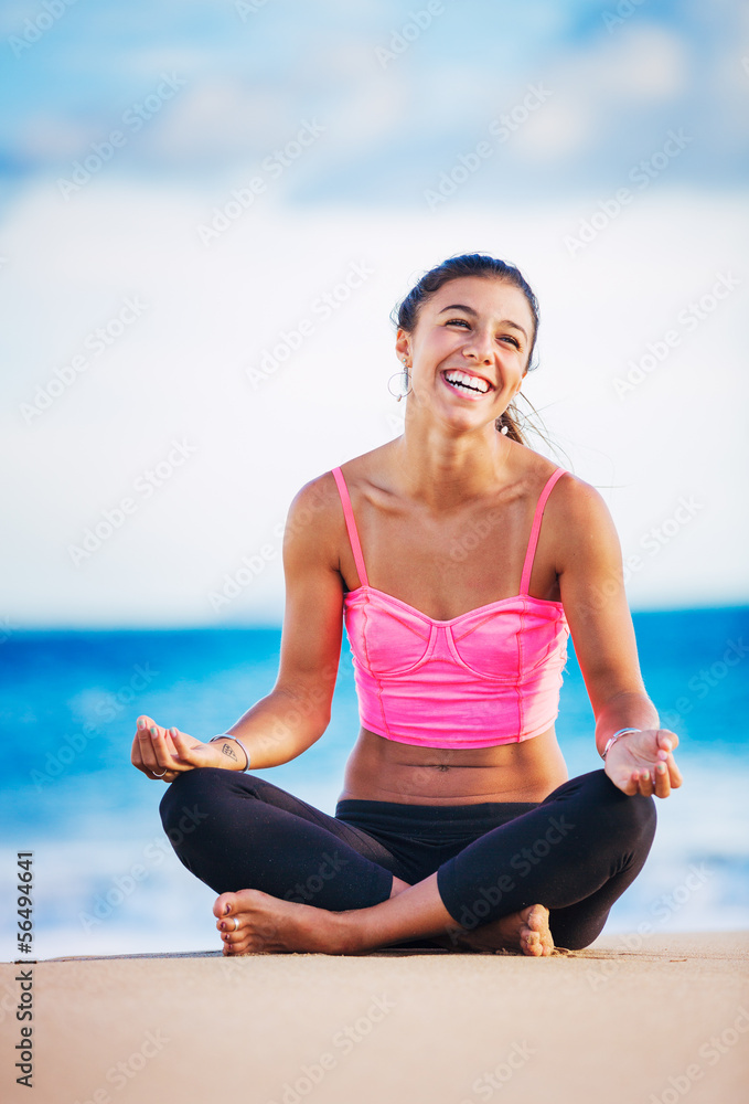 Woman practicing yoga at sunset Woman practicing yoga at sunset