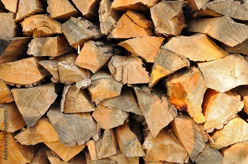 Stack of chopped firewoods prepared for winter