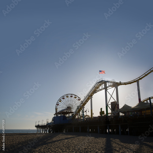 Santa Moica pier Ferris Wheel at sunset in California