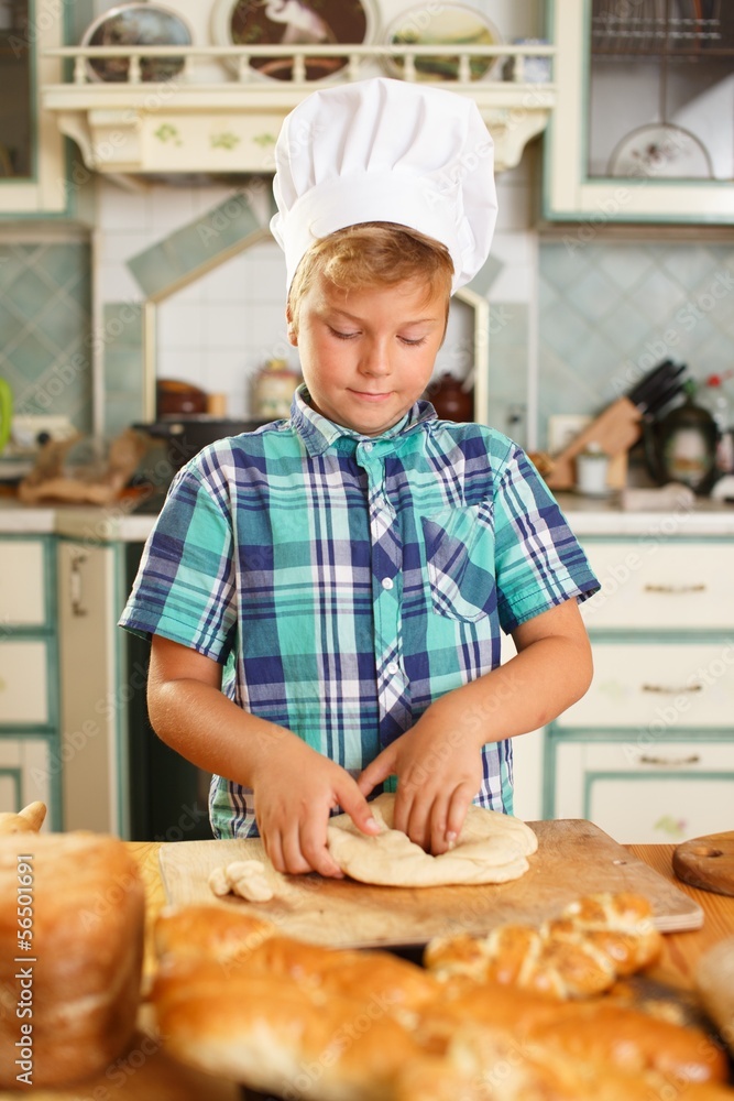 Young cook boy making homemade pastry Young cook boy making homemade pastry