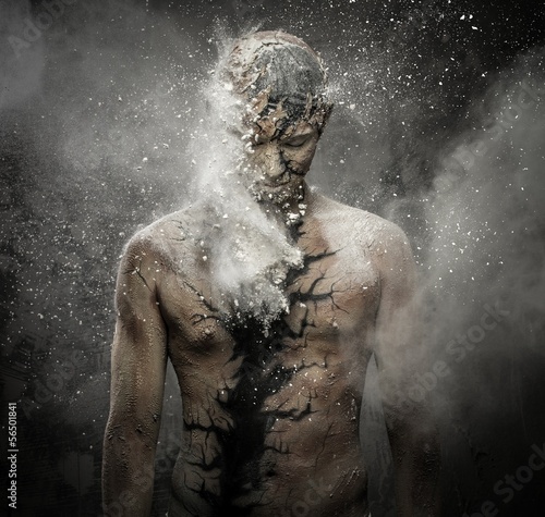 Man with conceptual spiritual body art photo