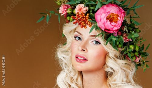 beautiful blonde girl in a wreath of flowers