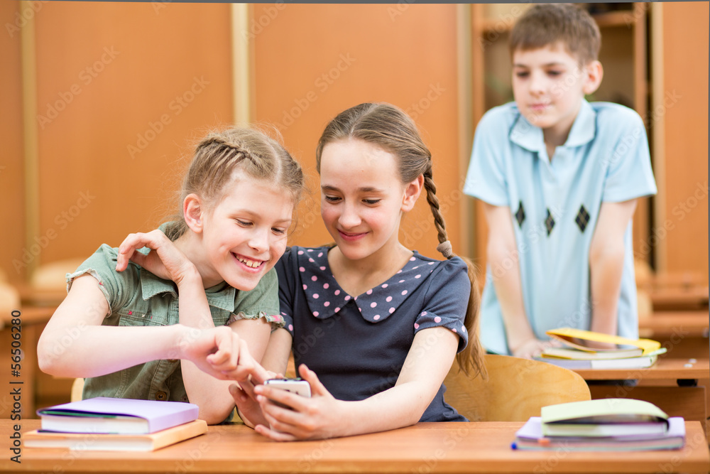 school kids with cell phones in classroom school kids with cell phones in classroom