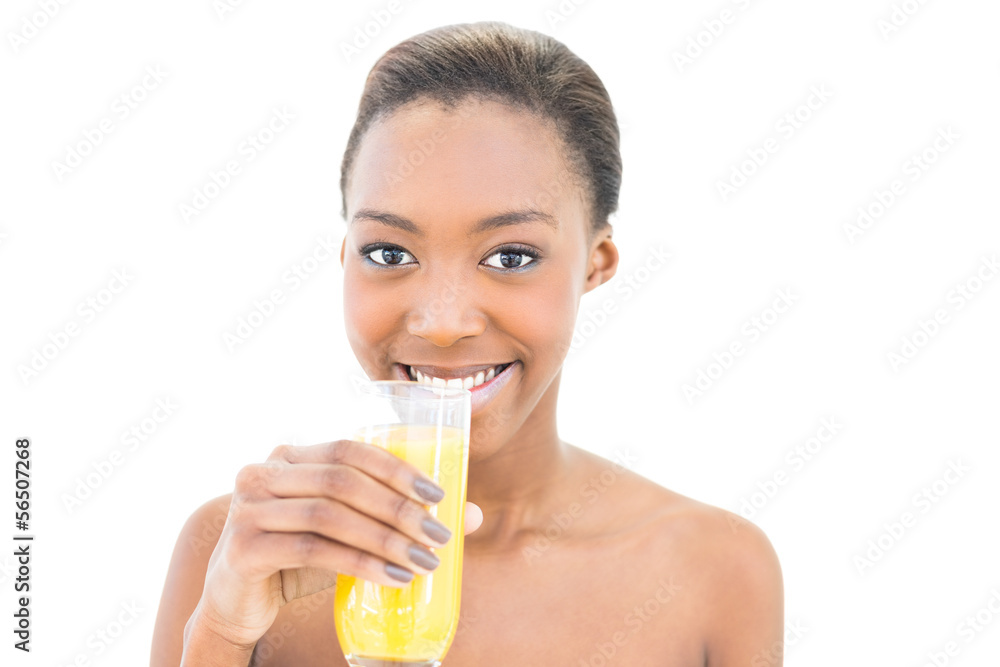 Cheerful natural beauty drinking orange juice Cheerful natural beauty drinking orange juice